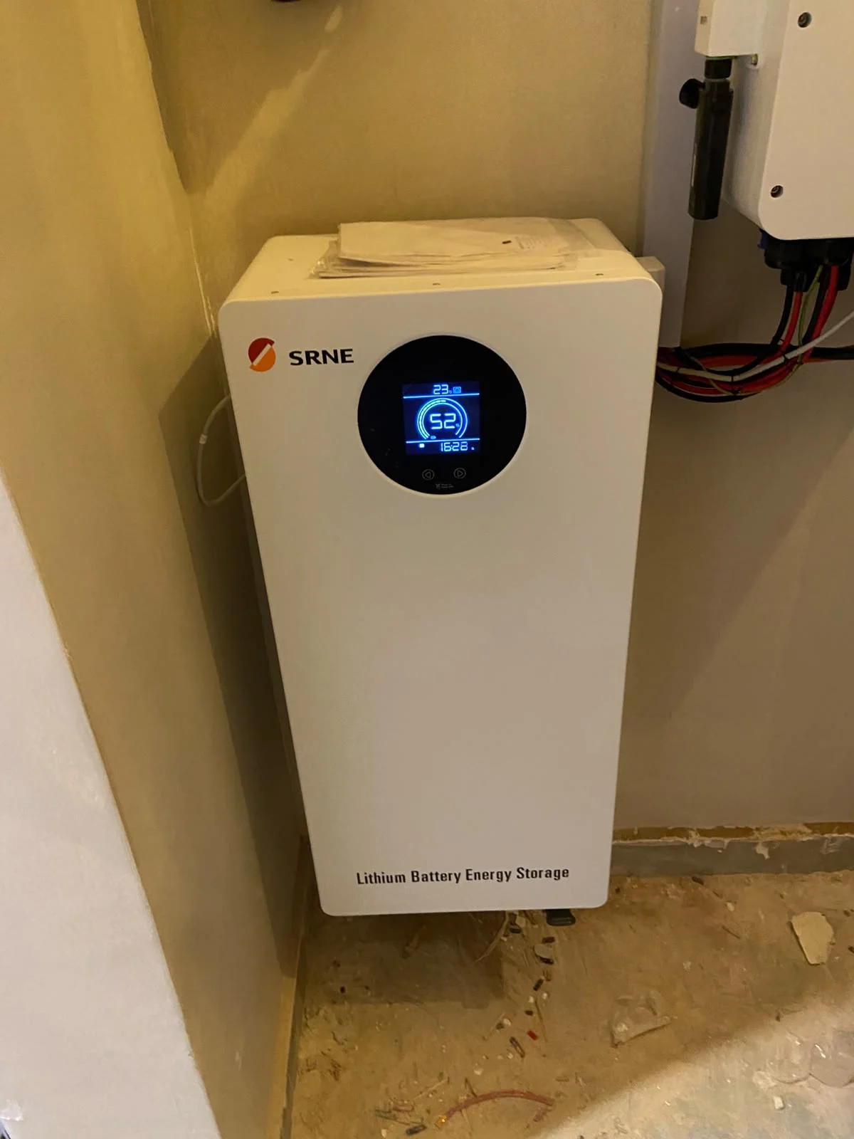 Installed wall-mounted power backup battery and connected equipment
