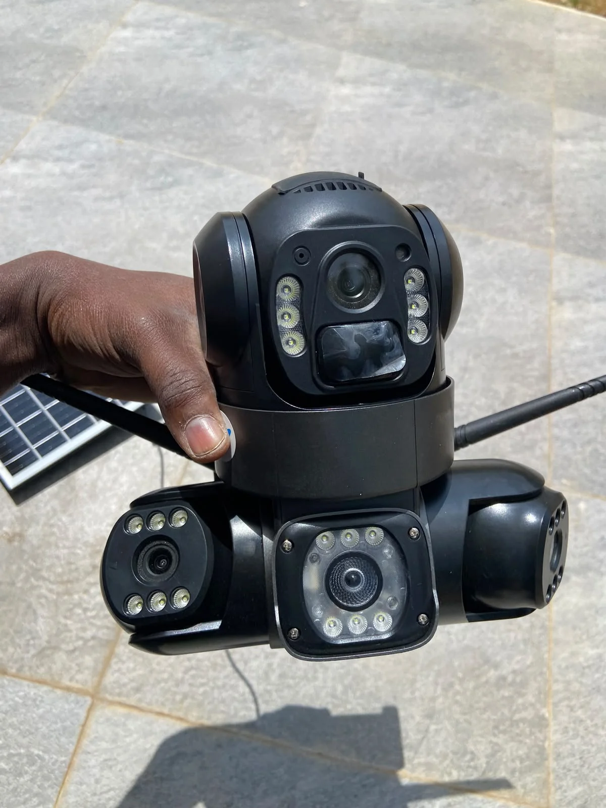 Outdoor CCTV cameras held during installation preparation